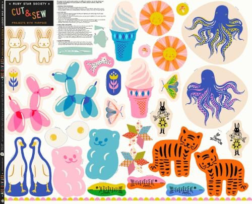 Collection of colorful cut-out shapes with various designs on a white quilting cotton background, Australia 