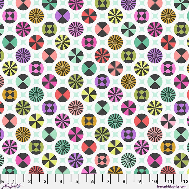 A repeating fabric pattern featuring colorful geometric medallions and starbursts on a white background, with a measurement ruler along the bottom edge,  perfect for quilting, patchwork, and creative sewing projects. Australia